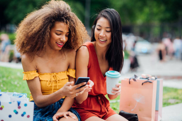 istock Two friends having fun after shopping 1191865518