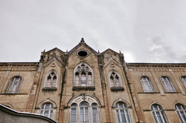 istock Aged old building facade with multiple windows. Historical city elements. European architecture 1191866815