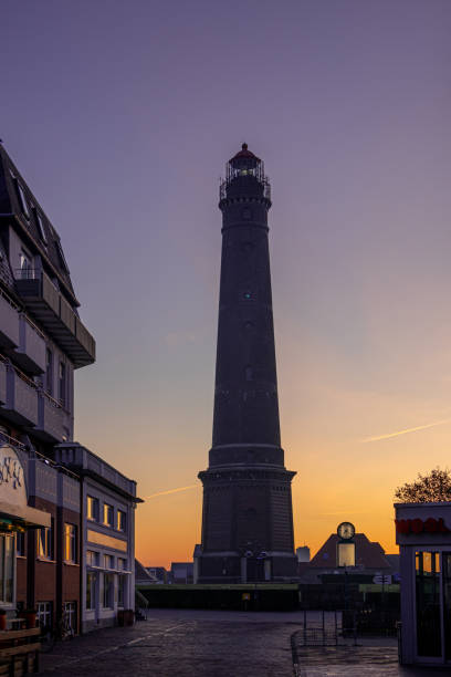istock lighthouse at dawn on island Borkum, travel germany 1191866906
