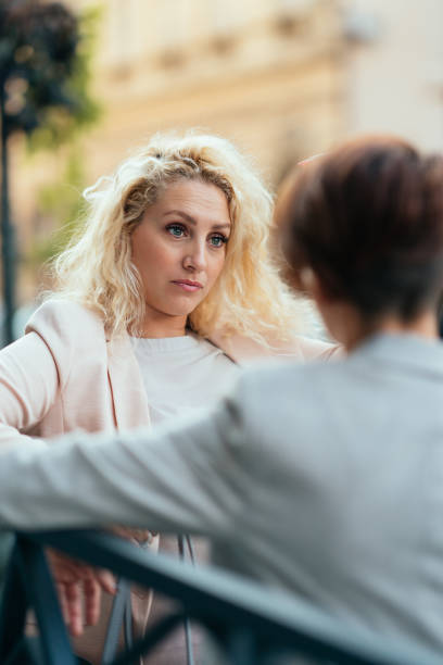 istock Girlfriends having discussion on the street 1191867647