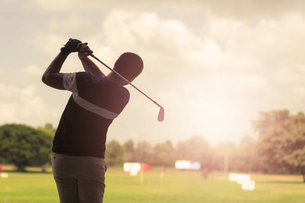 istock Rear View Of Man Playing Golf 1191867783