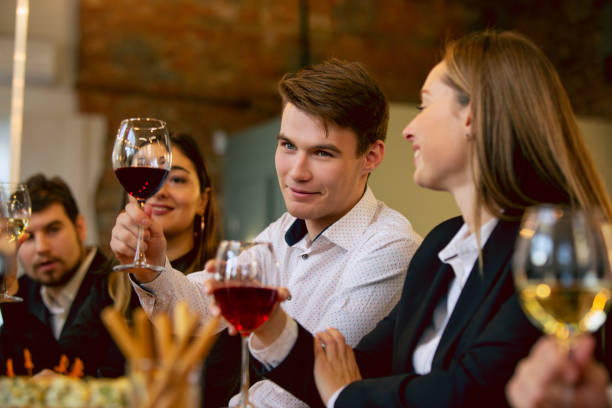 istock Happy co-workers celebrating while company party and corporate event 1191871140