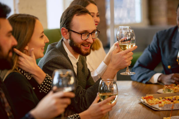 istock Happy co-workers celebrating while company party and corporate event 1191871143