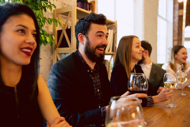istock Happy co-workers celebrating while company party and corporate event 1191871155