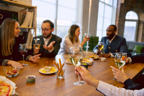 istock Happy co-workers celebrating while company party and corporate event 1191871335