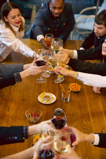 istock Happy co-workers celebrating while company party and corporate event 1191871475