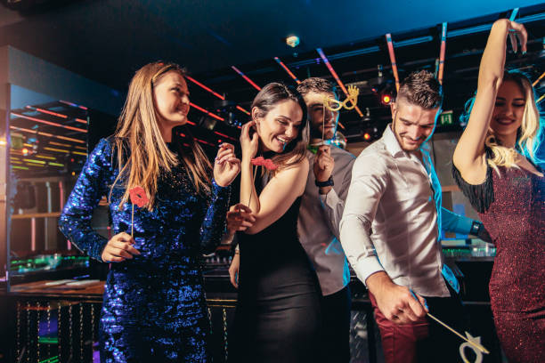 istock Friends dancing in night club and having fun 1191871488