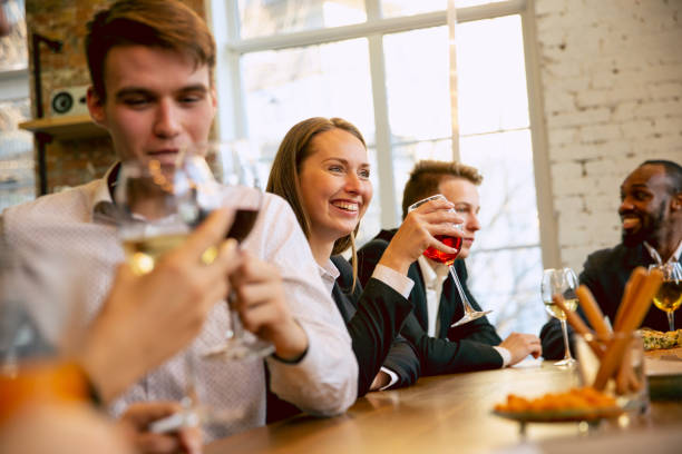 istock Happy co-workers celebrating while company party and corporate event 1191871601