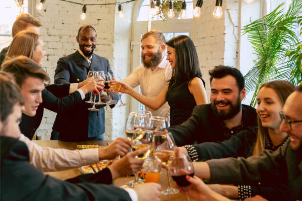 istock Happy co-workers celebrating while company party and corporate event 1191871607