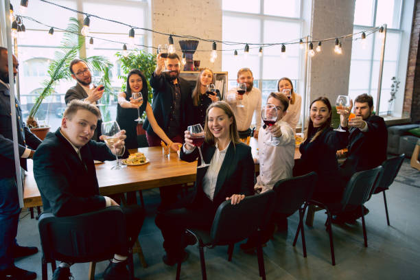 istock Happy co-workers celebrating while company party and corporate event 1191871643
