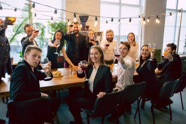 istock Happy co-workers celebrating while company party and corporate event 1191871675