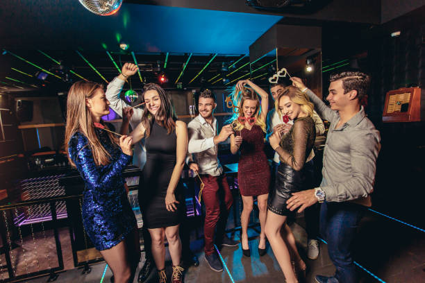 istock Friends dancing in night club and having fun 1191872014