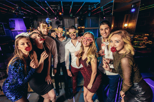 istock Friends dancing in night club and having fun 1191872016