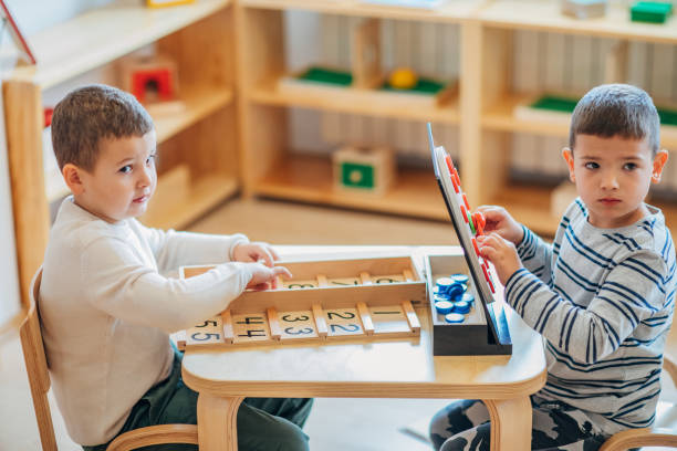 istock Two boys playing together in preschool classroom 1191874253