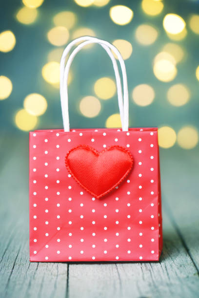 istock gift on wood background and bokeh background 1191874299