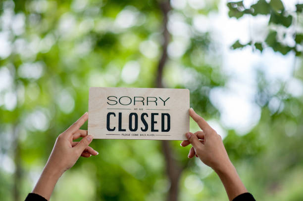 istock Hand and sign off shops 1191874353