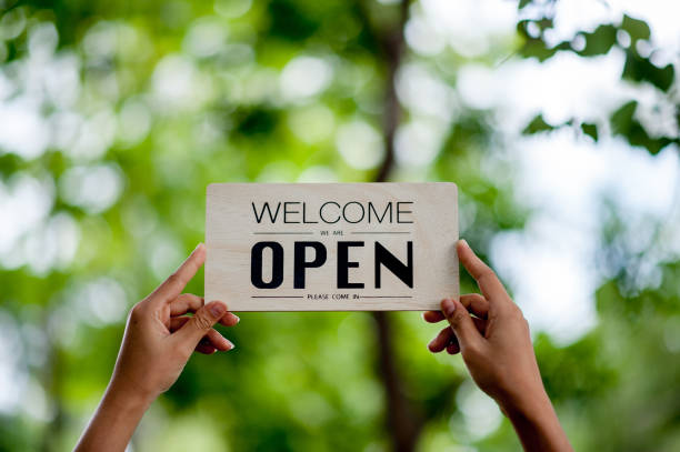 istock Hand and sign store opening 1191874354