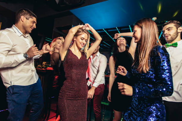istock Friends dancing in night club and having fun 1191874792