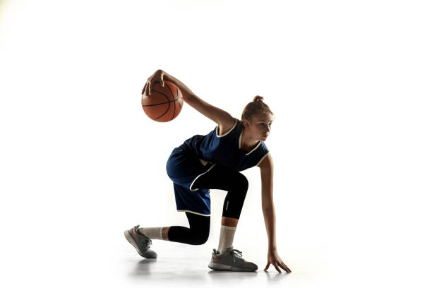 istock Young caucasian female basketball player against white studio background 1191875673