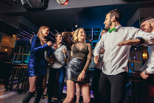 istock Friends dancing in night club and having fun 1191875849