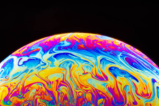 istock Macro shot of a soap bubble hemisphere. Abstract colorful liquid background. 1191879785
