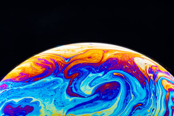 istock Macro shot of a soap bubble hemisphere. Abstract colorful liquid background. 1191879833