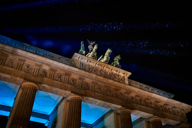 istock Berlin Brandenburg Gate at night illuminated in blue 1191879891