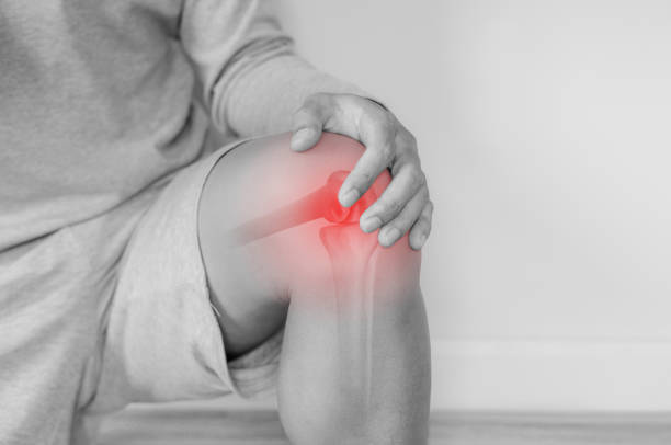 istock Joint pain, Arthritis and tendon problems. a man touching nee at pain point 1191879923