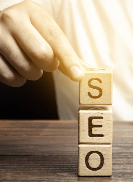 istock Blocks with the word SEO and businessman. Search Engine Optimization. Increase the quality and quantity of website traffic by increasing the visibility of a website 1191880180