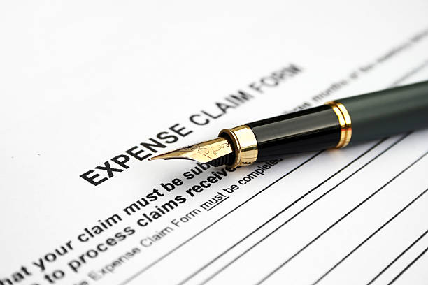 istock An expense claim form with black calligraphy pen laid on top 119188090
