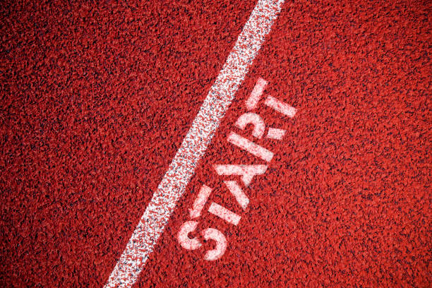 istock Starting line sign at running track background 1191881774