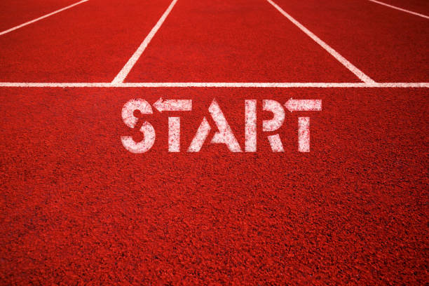 istock Starting line sign at running track background 1191881796
