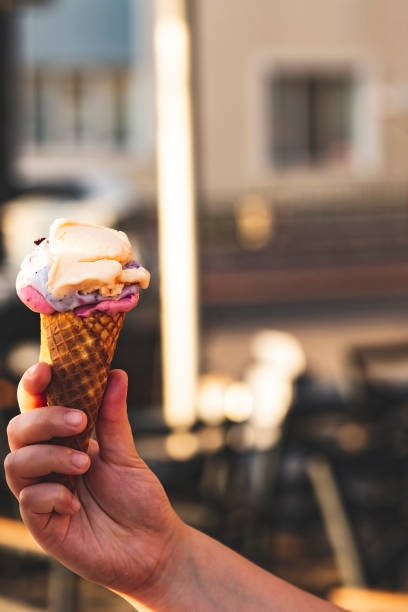 istock ice cream in couple hands 1191882831