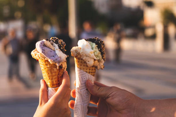 istock ice cream in couple hands 1191882834