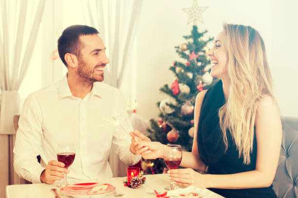 istock Man and woman at christmas dinner 1191886088