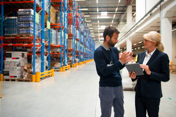 istock Managers in Warehouse discuss about business 1191888371