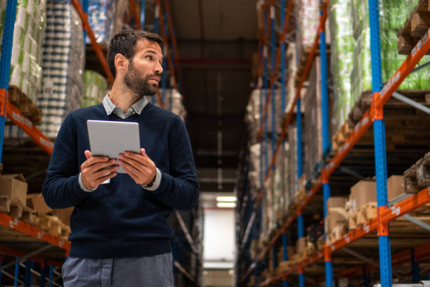 istock Manager holding digital tablet in warehouse 1191888524
