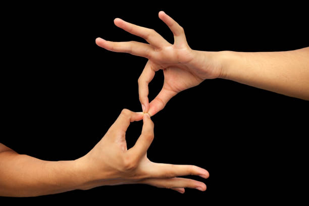 isolated hands of male teenage boy doing dharmachakra yoga mudrawith two hands. horizontal shot of male teenage boy doing dharmachakra mudra. - hand sign index finger human finger human thumb imagens e fotografias de stock