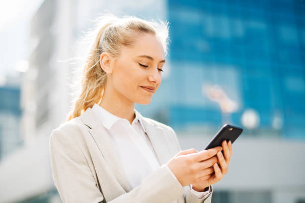 istock Beautiful businesswoman using mobile phone 1191889751