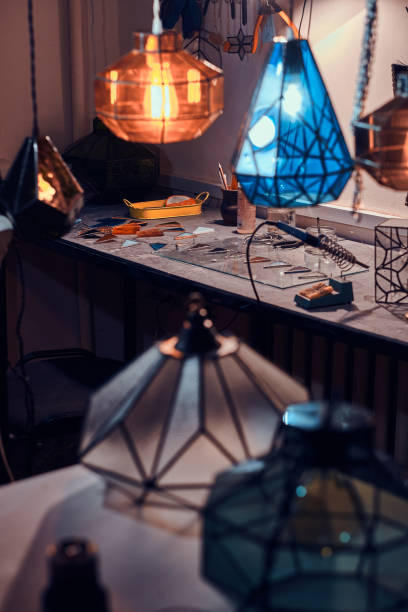 istock Different colourfu lamps at busy glass workshop 1191889925
