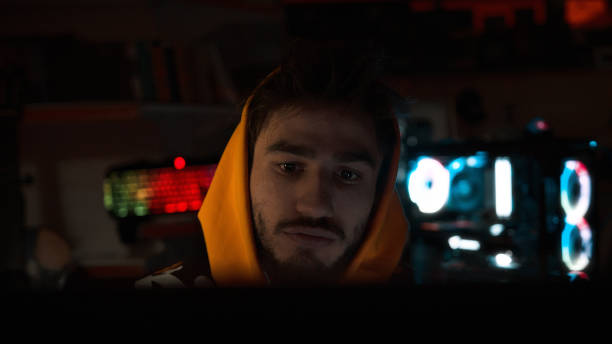 istock Handsome game streamer exhausted to play boring game. Streamer and gamer concept 1191890367
