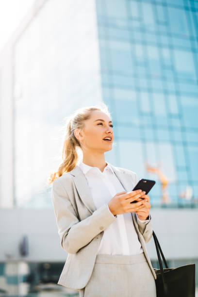 istock Beautiful businesswoman using mobile phone 1191890994