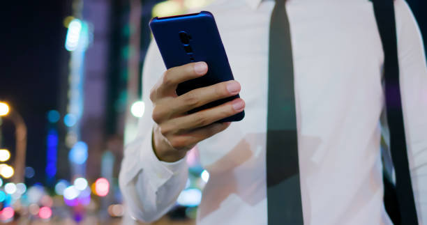 istock businessman use phone outdoor 1191891480