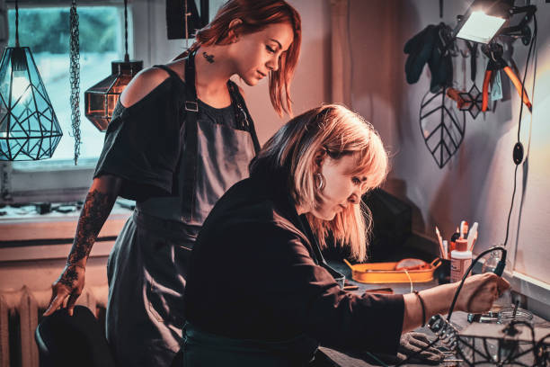 istock Two womens are working at glass studio. 1191891941