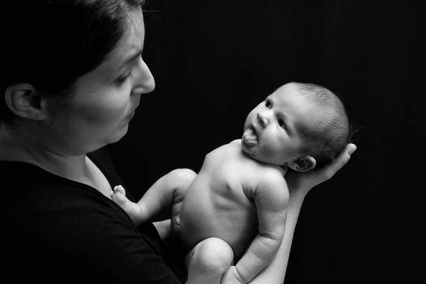 istock Newborn baby with her young family 1191894021