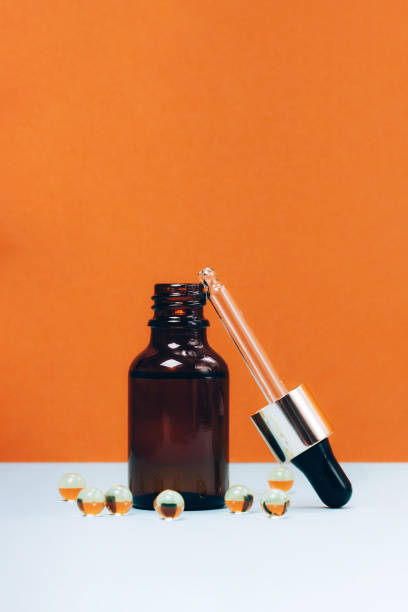 istock Face serum and vitamin capsules 1191894036