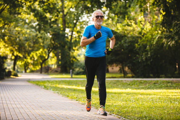 istock Senior man jogging in the park 1191895693