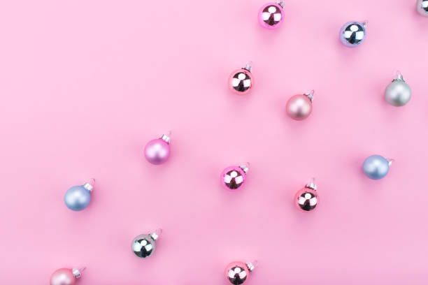 istock Stylish Christmas baubles decoration on pink background. 1191897012