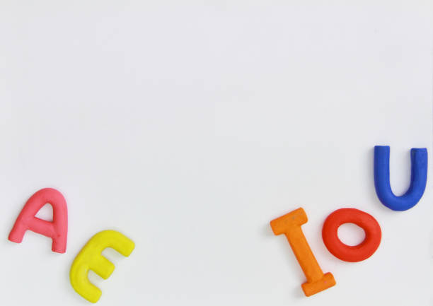 istock colored vowels in clay with white background 1191898825