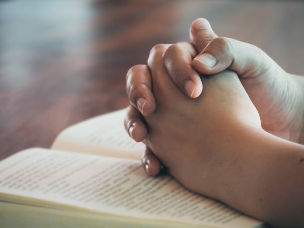 istock Hand of woman praying 1191899029